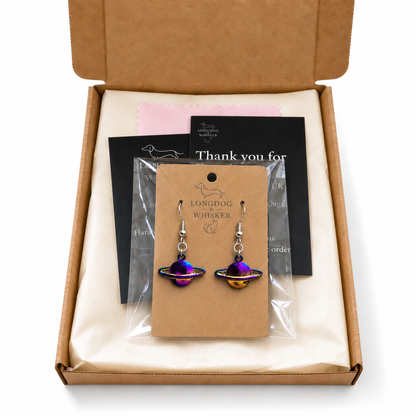 Iridescent rainbow Saturn planet earrings in Longdog and Whisker gift packaging