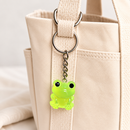 Large Neon Green Frog Keyring and Bag Charm attached to a cream canvas bag