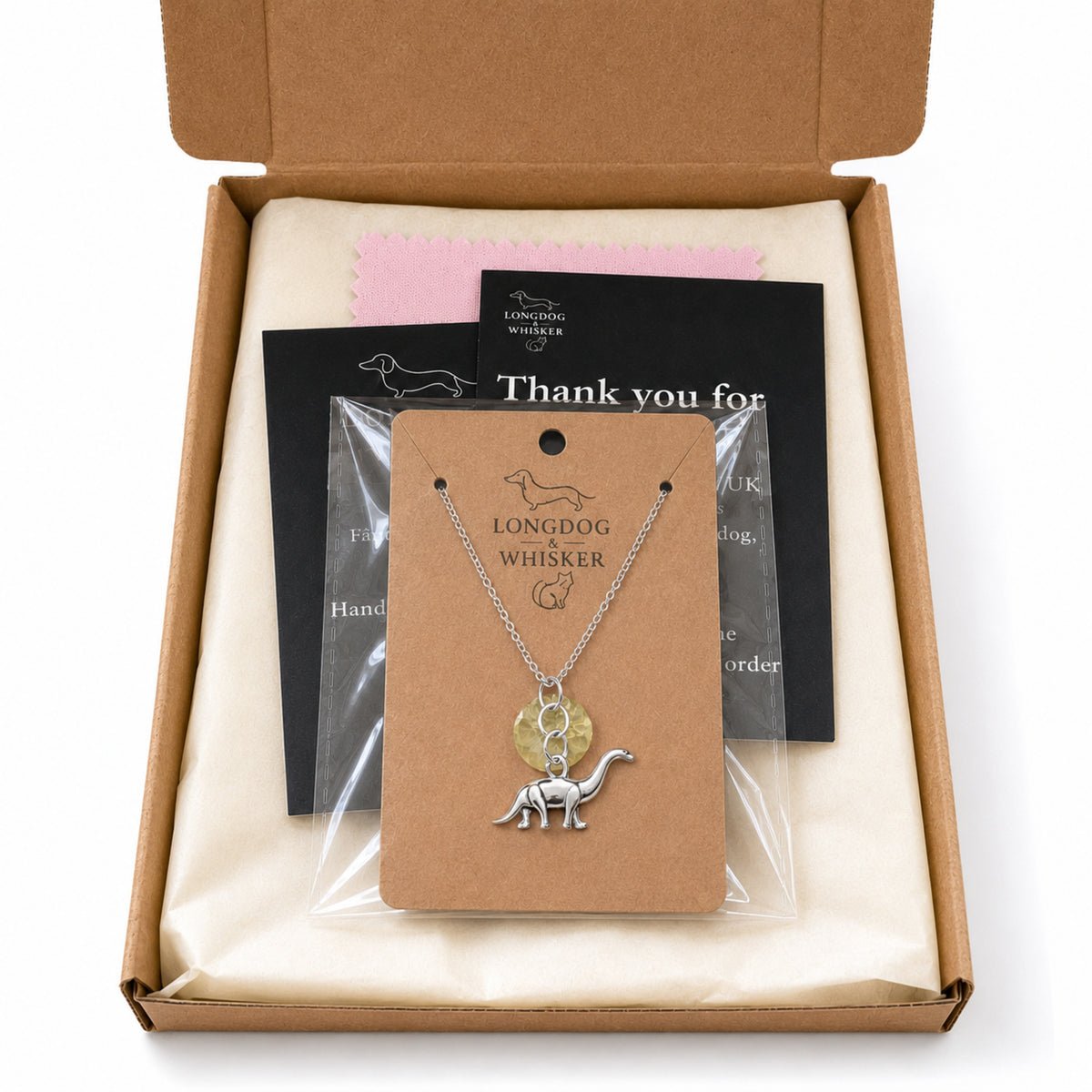 Silver Brontosaurus Dinosaur Necklace with Longdog & Whisker packaging