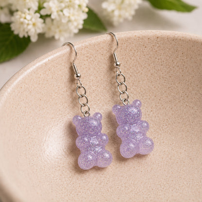 Gummy Bear Earrings - Lilac Glitter displayed in a lifestyle product photo