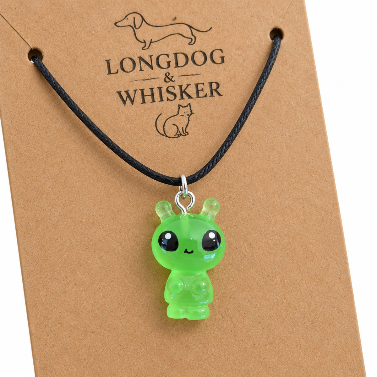 Close-up of the Little Green Alien Black Cord Necklace pendant