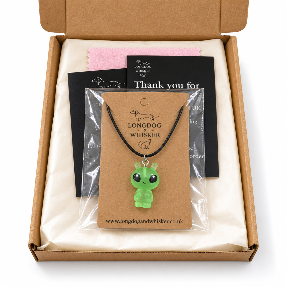 Little Green Alien Black Cord Necklace in Longdog & Whisker packaging