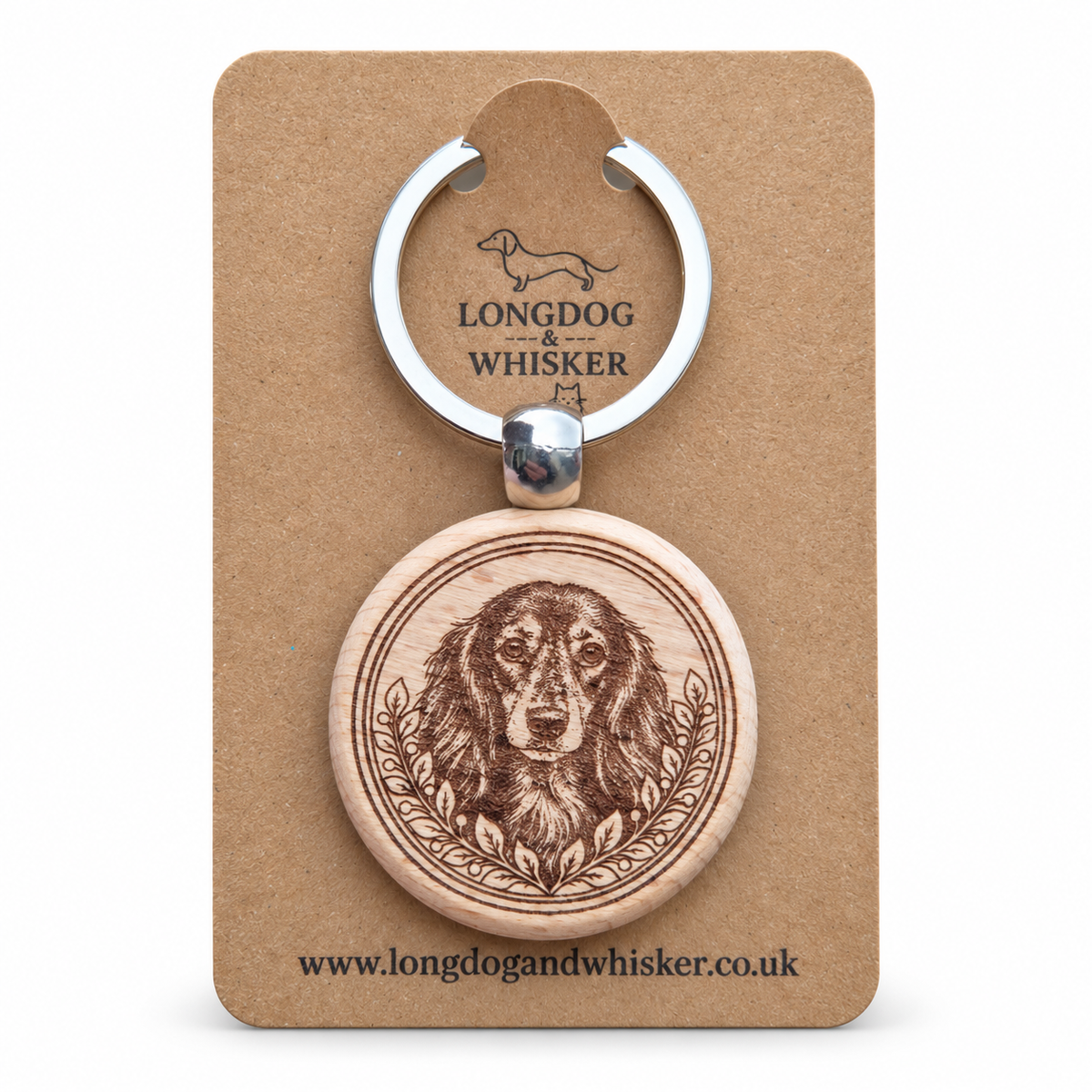 Long-haired Dachshund wooden keyring with leafy portrait frame on Longdog & Whisker kraft card