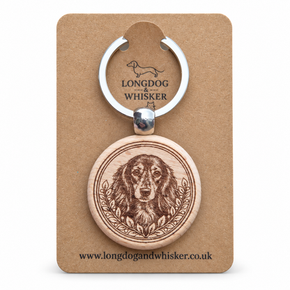 Long-haired Dachshund wooden keyring with leafy portrait frame on Longdog & Whisker kraft card
