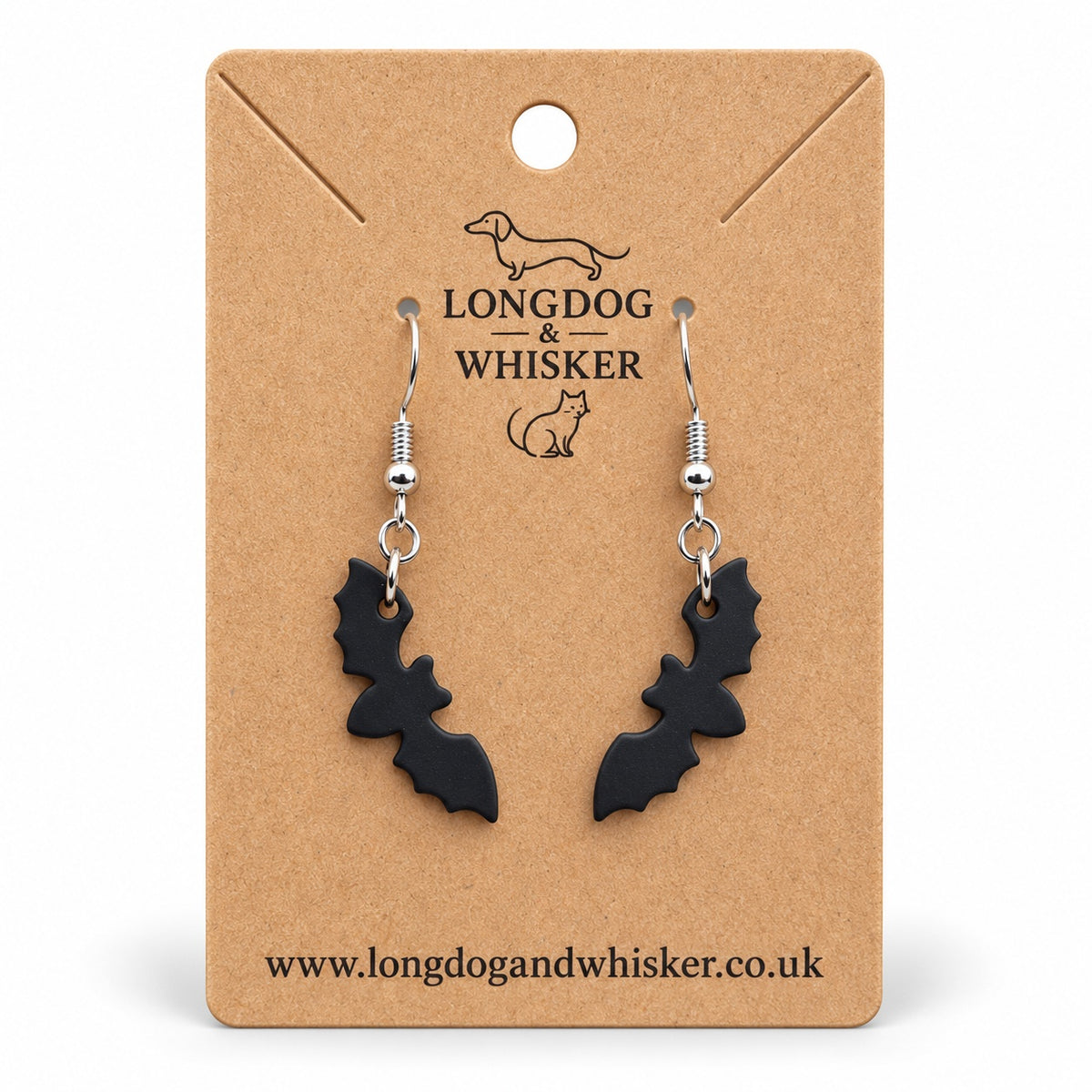 Matte black bat silhouette drop earrings on a Longdog & Whisker kraft card
