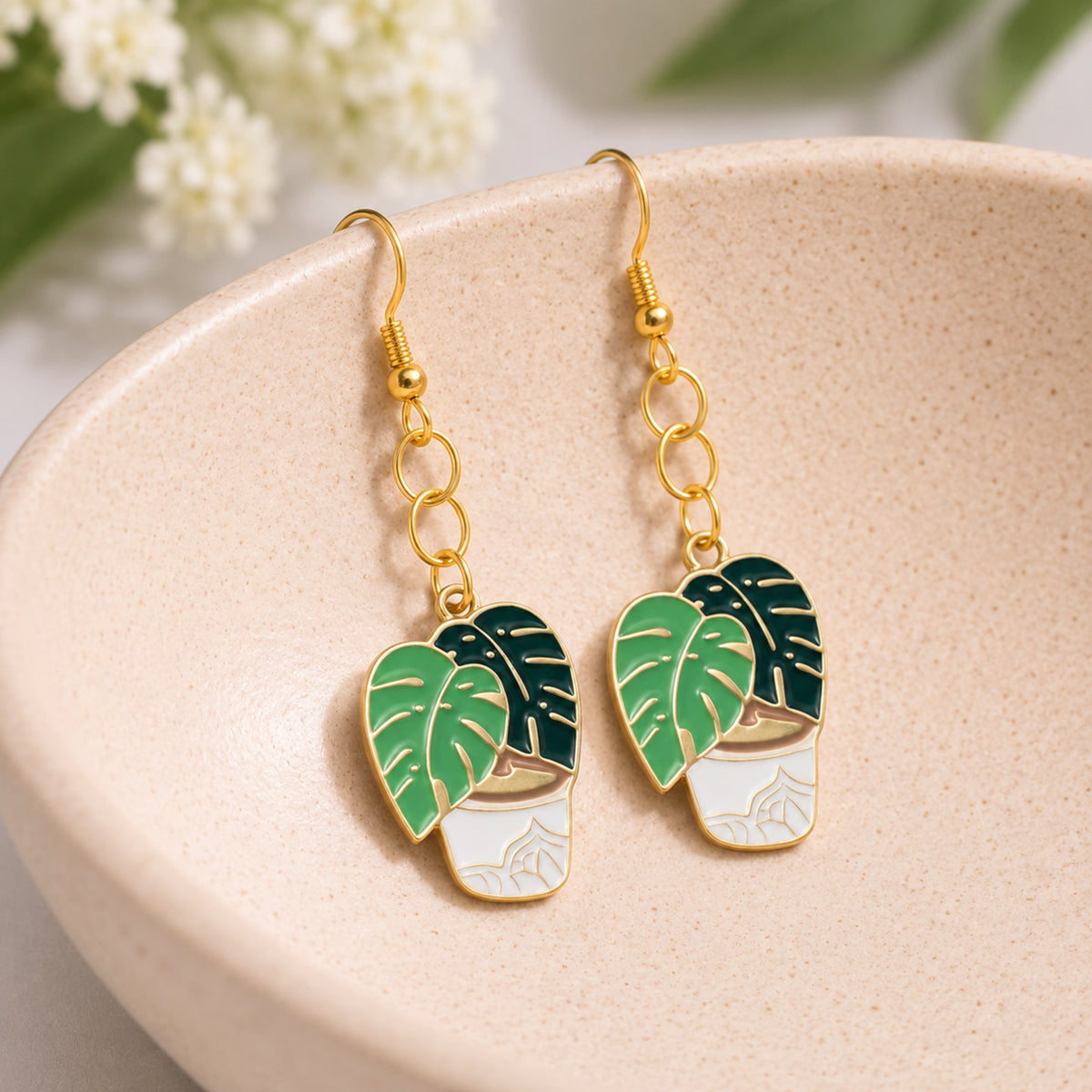 Monstera Earrings displayed in a lifestyle product photo
