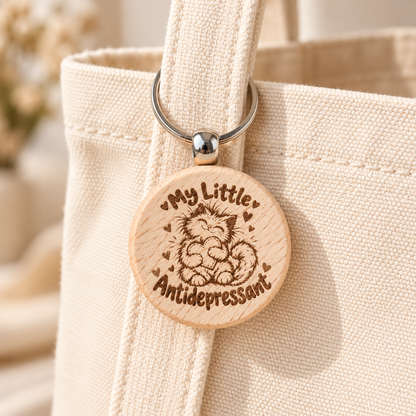 My Little Antidepressant wooden cat keyring attached to a cream tote bag