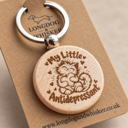 Close-up of the cat and heart design on the My Little Antidepressant wooden keyring