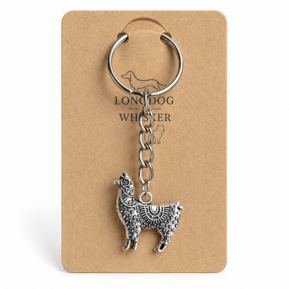 Close-up of ornate silver-tone llama keyring and chain