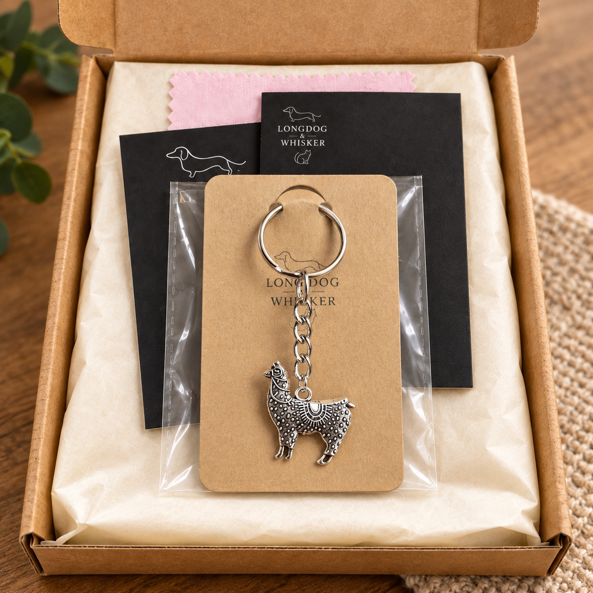 Ornate silver-tone llama keyring in Longdog & Whisker gift packaging