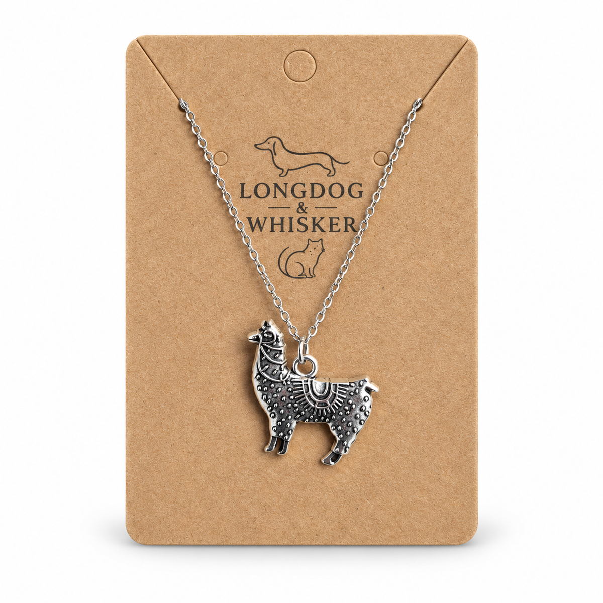 Ornate silver-tone llama pendant necklace on Longdog & Whisker display card