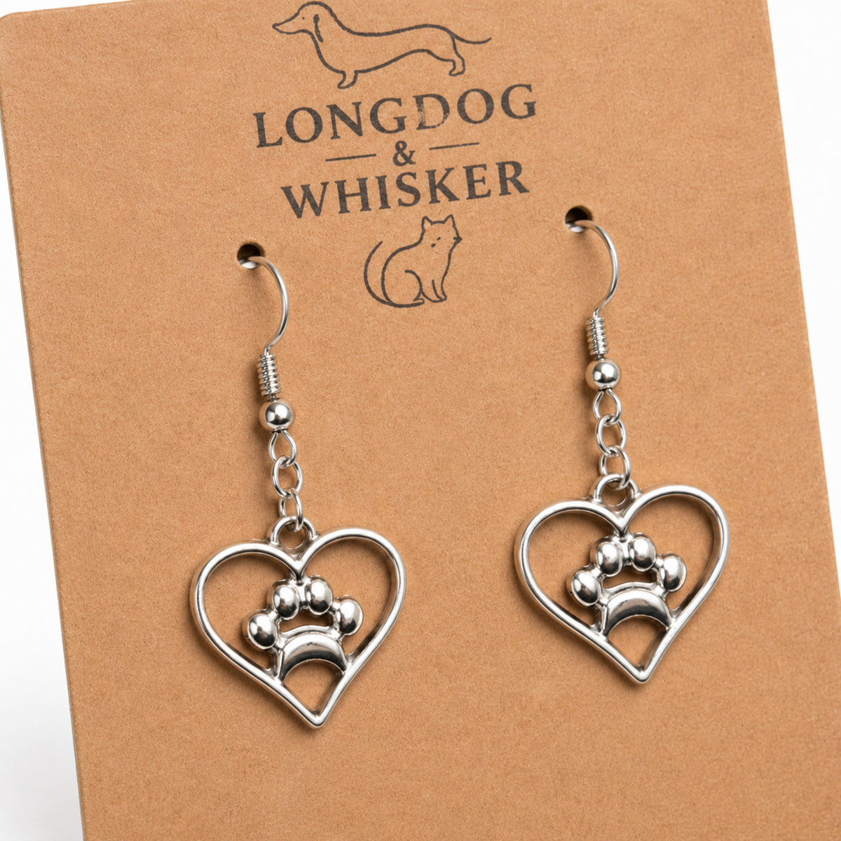 Close-up detail of Silver Heart Dog Paw Print Earrings