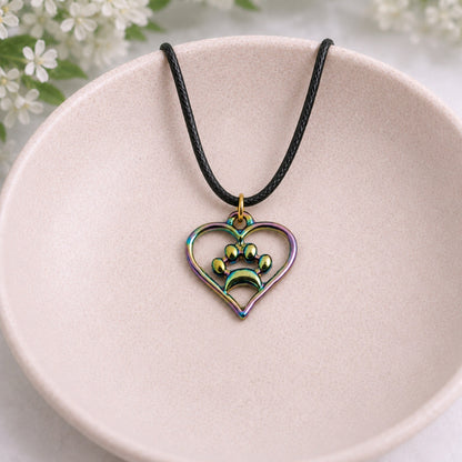 Iridescent Heart Dog Paw Print Necklace displayed in a lifestyle product photo