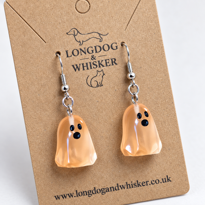 Close detail of Peach Ghost Earrings and silver-tone hooks