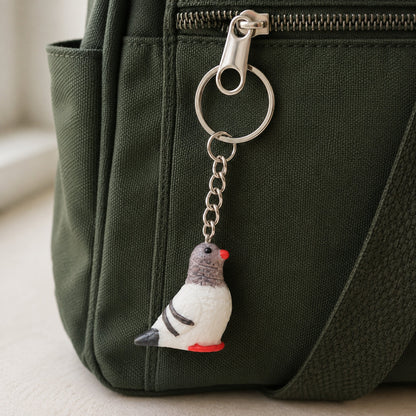 Pigeon Keychain Bag Charm clipped to a bag zip