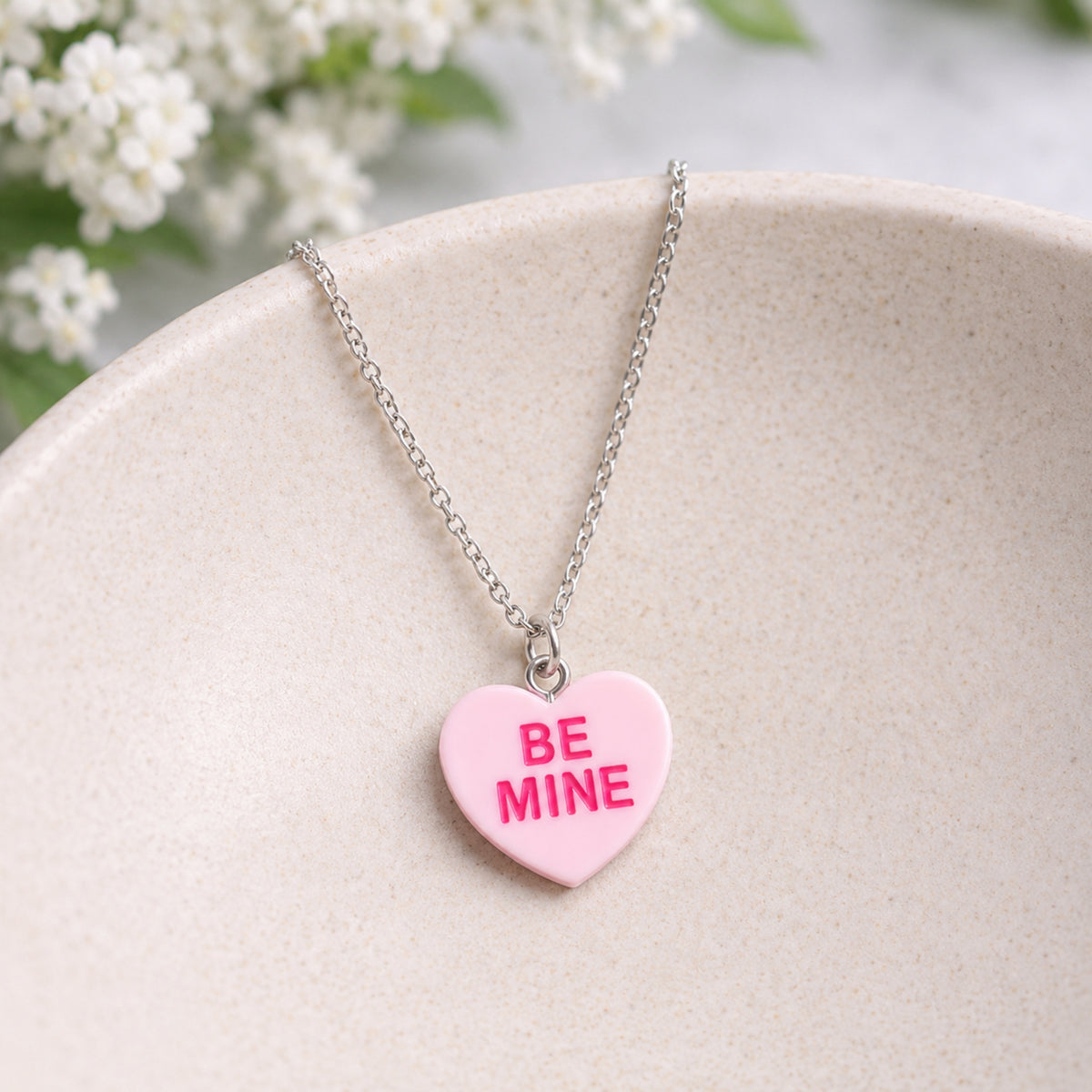 Be Mine Necklace - Pink displayed in a lifestyle product photo