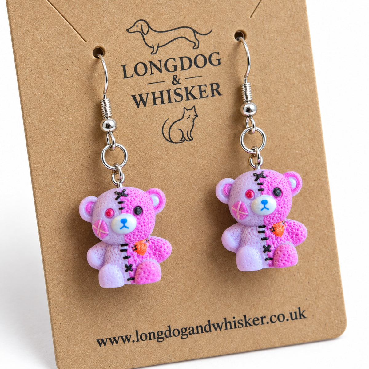 Close detail of Pink Pastel Stitched Zombie Bear Earrings and silver-tone hooks