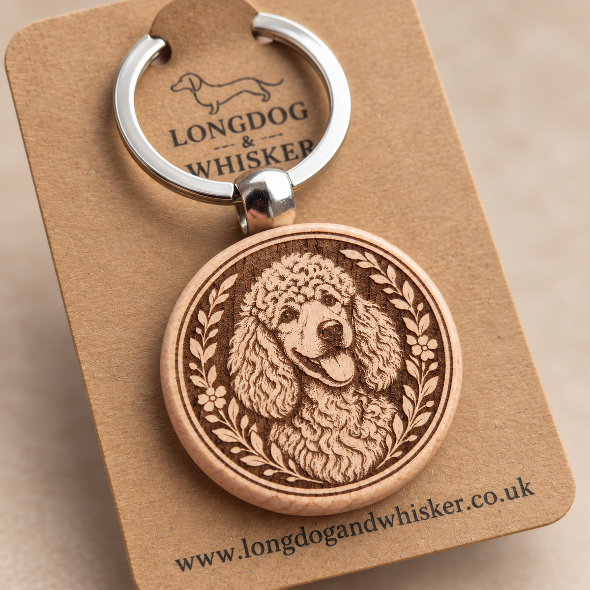 Close-up of the printed Poodle wooden keyring and silver-tone hardware