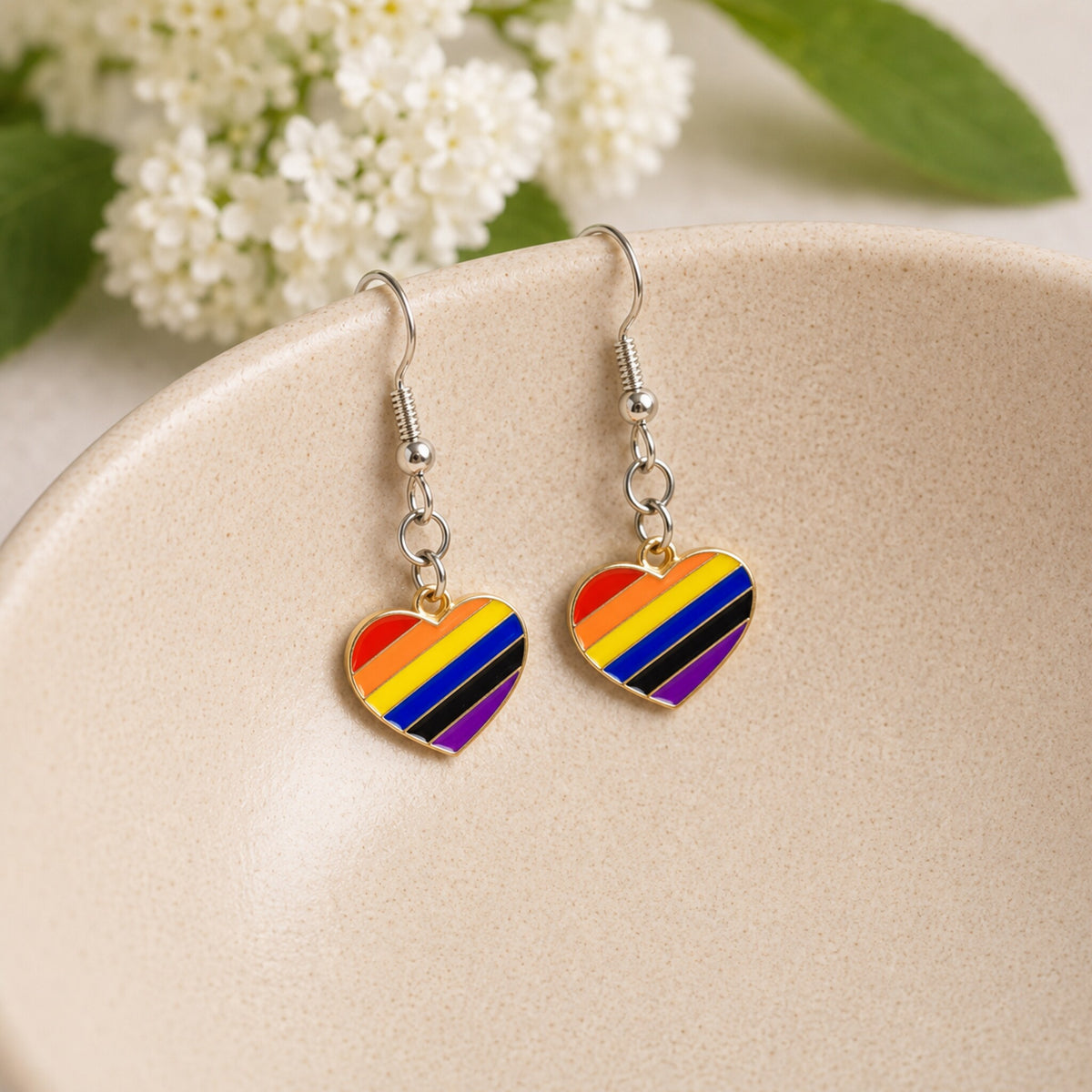 Pride Rainbow Heart Drop Earrings Silver Hooks displayed in a lifestyle product photo