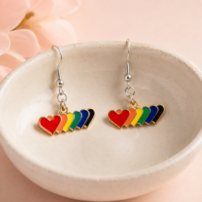 Pride Rainbow Heart Trail Drop Earrings Silver Hooks displayed in a lifestyle product photo