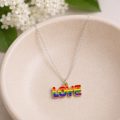 Pride Rainbow Love Necklace Silver Chain displayed in a lifestyle product photo