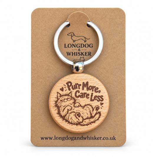 Purr More Care Less wooden keyring with lounging cat on Longdog & Whisker card