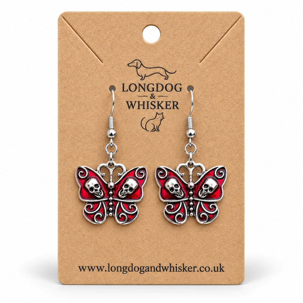 Red skull butterfly earrings with silver-tone skulls and scrollwork on a Longdog & Whisker kraft card