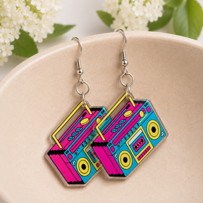 Retro Boombox Earrings hanging from a ceramic bowl