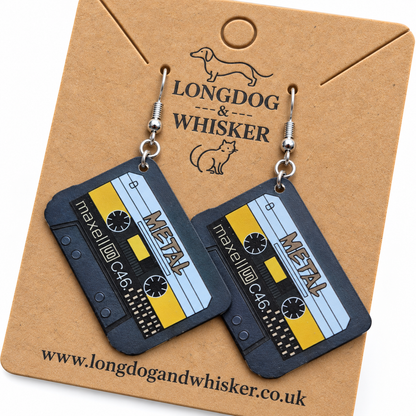 Close detail of black blue and yellow metal cassette tape earrings