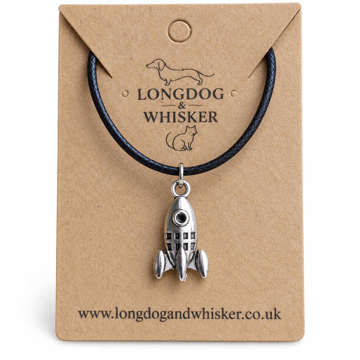 Close-up of the silver rocket pendant on black cord