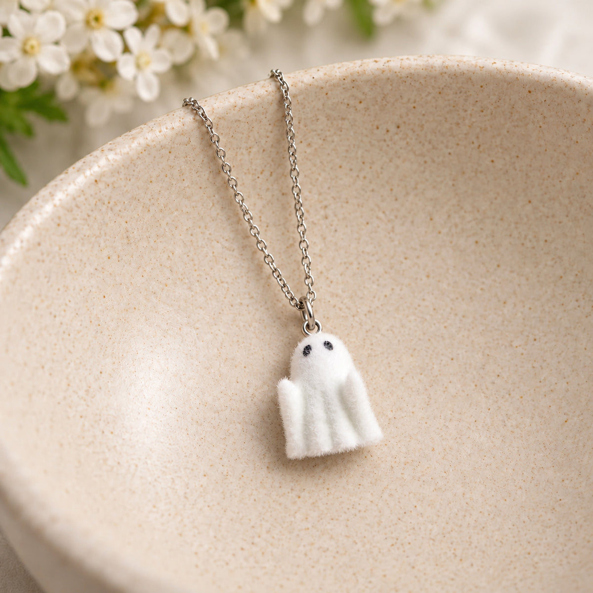 Rudie Ghost Necklace in a ceramic bowl