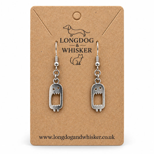 Screaming monster drop earrings on Longdog & Whisker kraft card