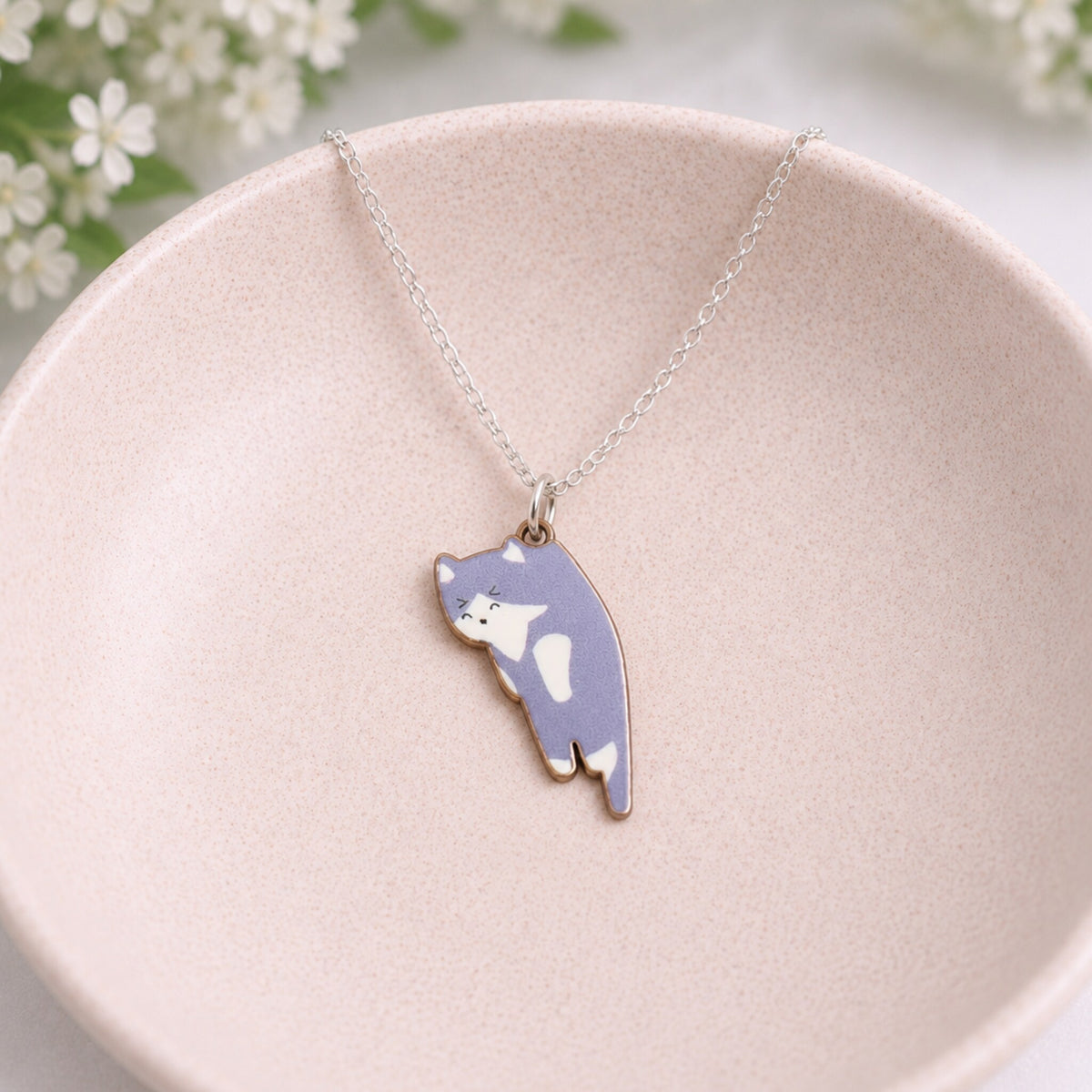 Scruffles Cat Necklace - Grey displayed in a lifestyle product photo