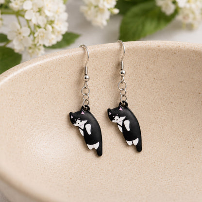 Scruffles Cat Earrings - Black & White displayed in a lifestyle product photo