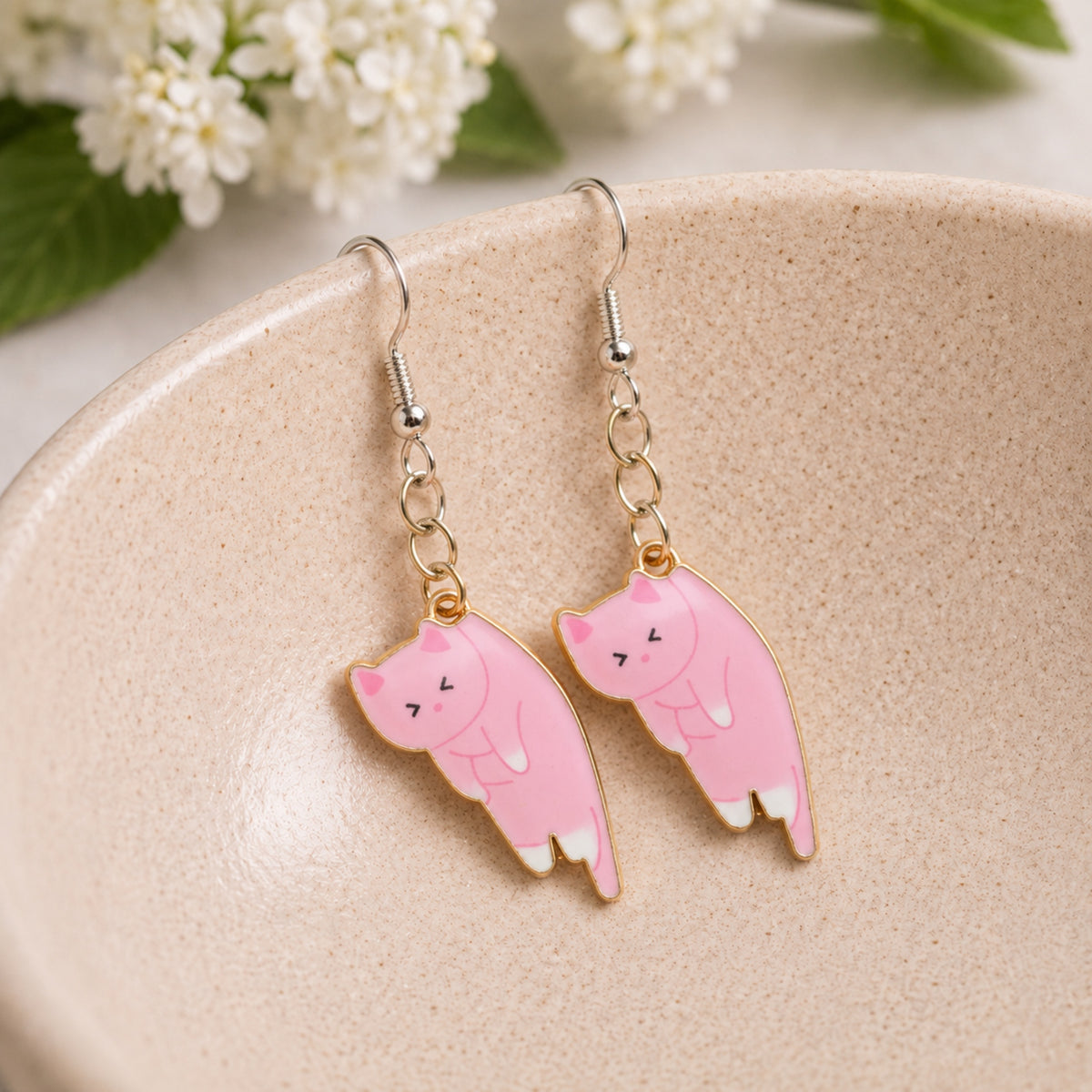 Scruffles Cat Earrings - Pink displayed in a lifestyle product photo