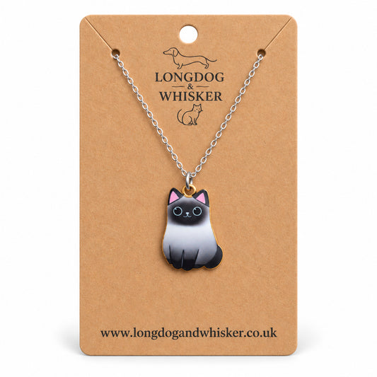Siamese Chonky Cat Necklace on a silver-tone chain displayed on a Longdog & Whisker kraft card
