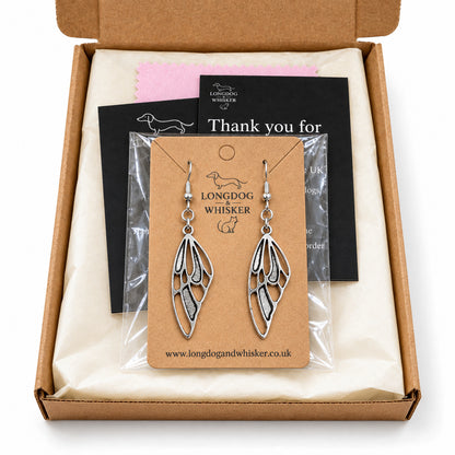 Silver-tone butterfly wing earrings in Longdog & Whisker kraft packaging