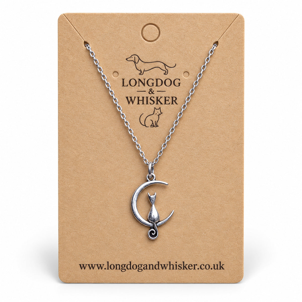 Silver cat and crescent moon necklace on a Longdog & Whisker kraft card.