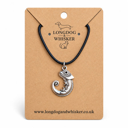 Silver-tone chameleon necklace on black cord on a Longdog & Whisker kraft card