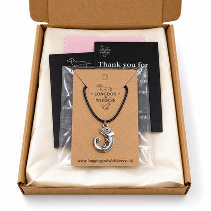 Silver-tone chameleon black cord necklace in Longdog & Whisker kraft packaging