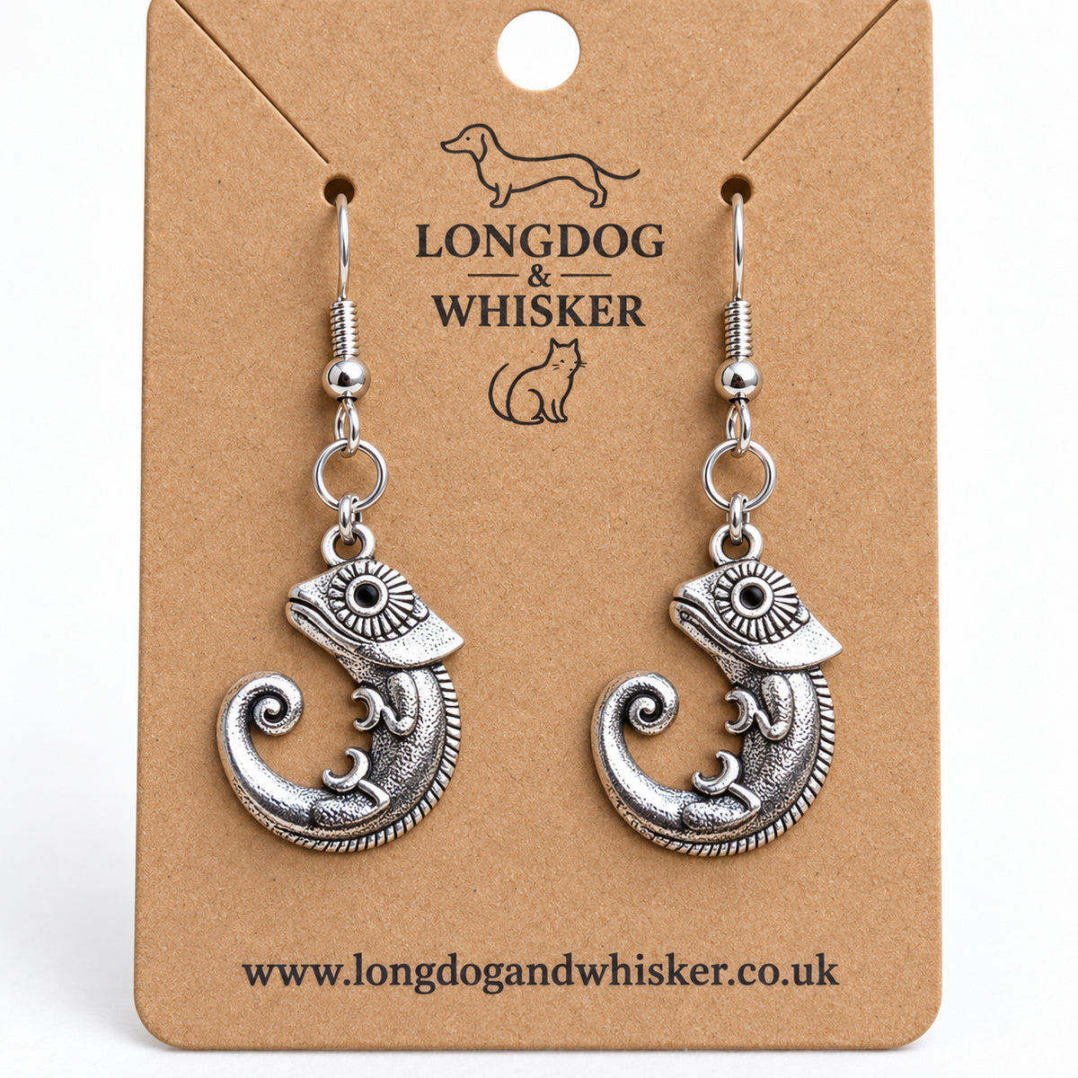 Close-up of the chameleon earrings' patterned eyes, spiral tails and linked connectors
