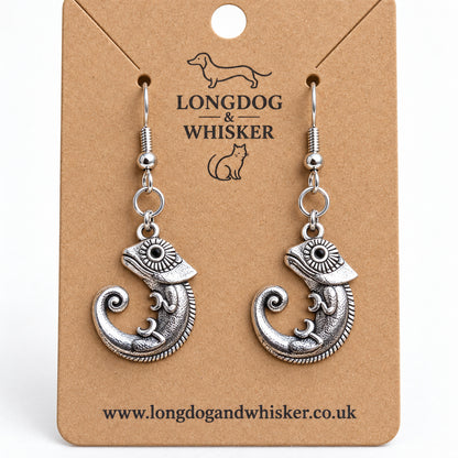 Close-up of the chameleon earrings' patterned eyes, spiral tails and linked connectors