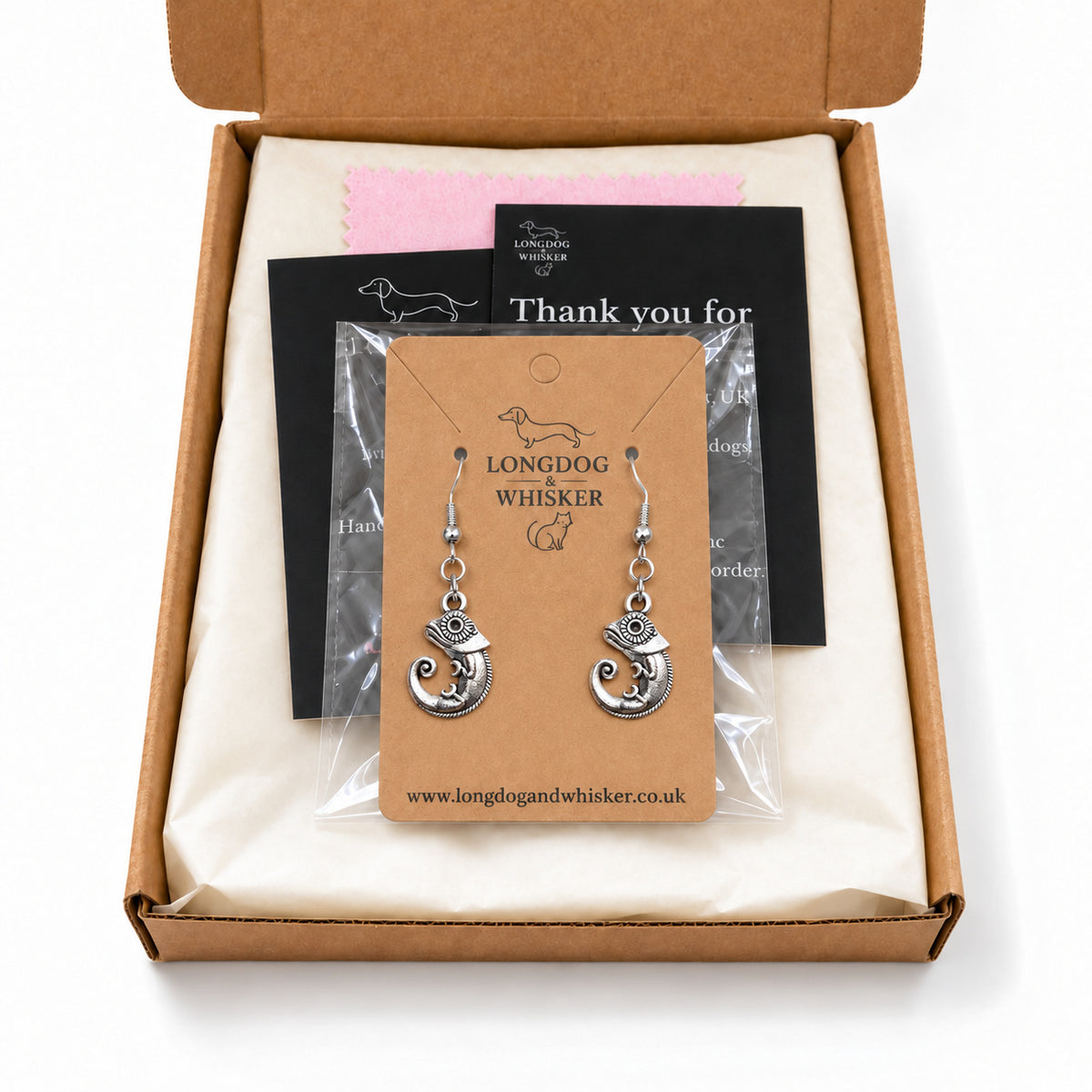 Silver-tone chameleon earrings in Longdog & Whisker kraft packaging