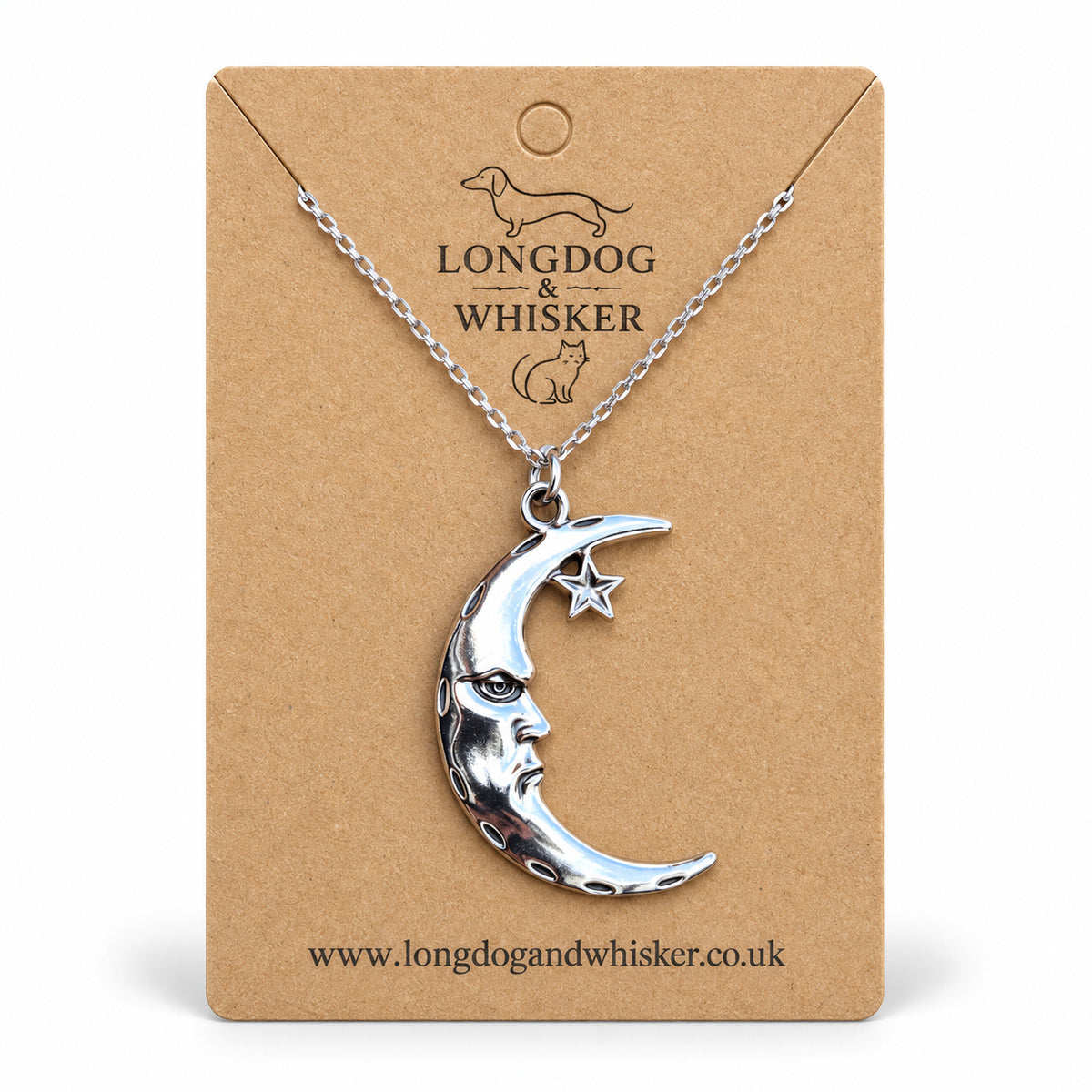 Silver crescent moon face and star necklace on a Longdog & Whisker kraft card