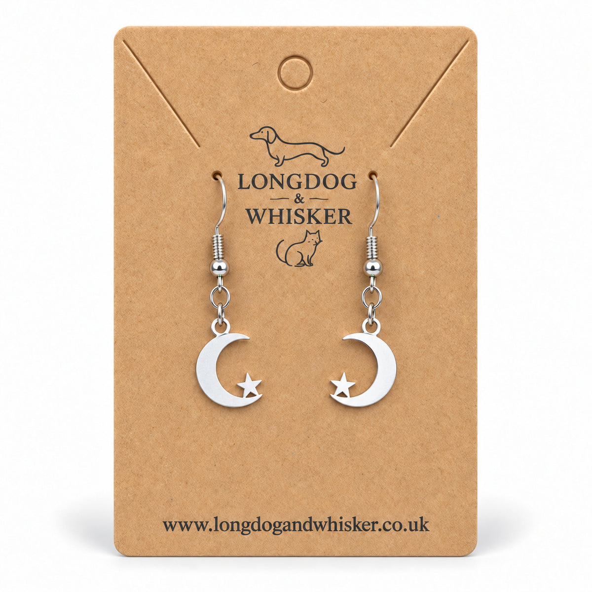 Silver crescent moon and star drop earrings on a Longdog & Whisker kraft card