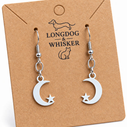 Close-up of the flat moon and star charms and silver-tone earring connectors