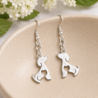 Cat At Heart Dog Earrings - Silver displayed in a lifestyle product photo