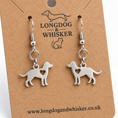 Close-up of the mirrored silver-tone dog charms, heart cut-outs and silver hook fittings