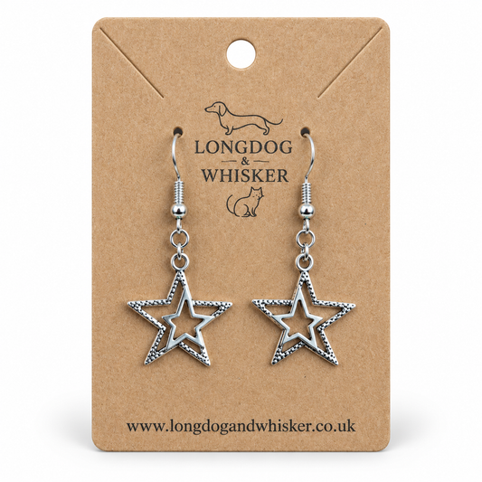 Silver double star drop earrings on a Longdog & Whisker kraft display card.