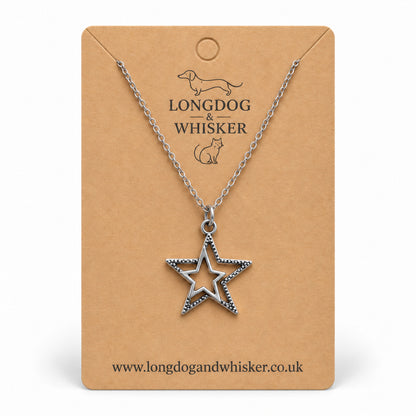 Silver double star necklace on a Longdog & Whisker kraft card.